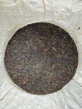 Load image into Gallery viewer, 2002 Zhongcha Kunming Tea Factory 8668 RED STAMP IRON CAKE 红印铁饼