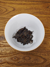 Load image into Gallery viewer, 2002 Zhongcha Kunming Tea Factory 8668 RED STAMP IRON CAKE 红印铁饼