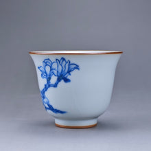 Load image into Gallery viewer, 75ml Qinghua Magnolia Moon White Ruyao Bell Teacup 汝窑青花手绘花卉
