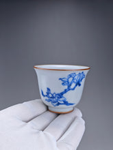 Load image into Gallery viewer, 75ml Qinghua Magnolia Moon White Ruyao Bell Teacup 汝窑青花手绘花卉
