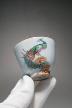 Load image into Gallery viewer, Fencai Hand Painted Peacock Moon White Ruyao Teacup No.2 粉彩孔雀杯 75ml
