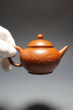 Load image into Gallery viewer, Fully Handmade Zhuni Shuiping Teapot with carvings of bamboo by Fan Yayun 全手工范亚云朱泥刻竹水平 145ml
