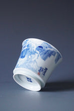 Load image into Gallery viewer, 85ml Qinghua Birds and Banana Tree Porcelain Teacup by KuangShi 青花匡石手绘花鸟蕉荫杯
