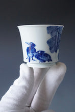 Load image into Gallery viewer, 85ml Qinghua Birds and Banana Tree Porcelain Teacup by KuangShi 青花匡石手绘花鸟蕉荫杯

