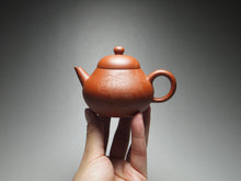 Load image into Gallery viewer, Zhuni Pear Shuiping Yixing Teapot with Carving of Lionhead Goldfish 朱泥梨式水平带刻绘 120ml
