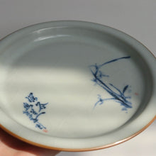 Load image into Gallery viewer, Moon White Ruyao Saucer with Orchids 月白汝窑壶承
